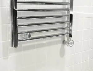 Displaying the interior of the new build property. Here we have a close up look at a chrome towel rail.