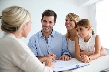 Photo of family talking to professional